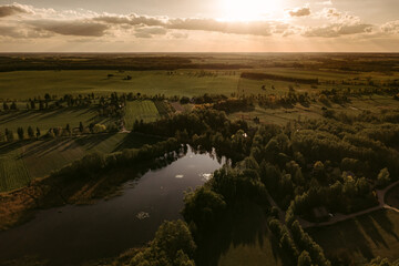 Wonderful landscape of green valley and lake in spring light