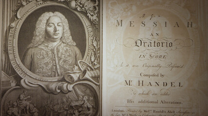Handel's Messiah 1st edition printing from the 1700's, panning over the book. - obrazy, fototapety, plakaty