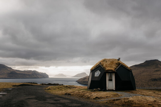 Lonely cabin on seashore in Nordic countryside
