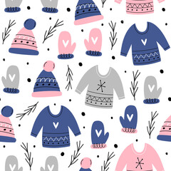 Christmas vector seamless pattern. Knitted sweater, mittens, hat, Christmas tree branches. Hand-drawn simple design