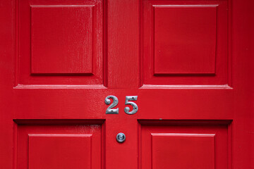 Detail of a red door with number