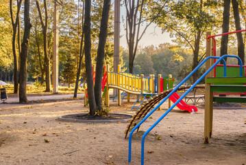 Empty playground at sunrise in autumn scenery