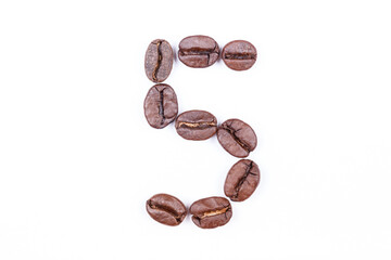 Number five made of coffee beans on a white background. Coffee beans isolated on white. Macro.