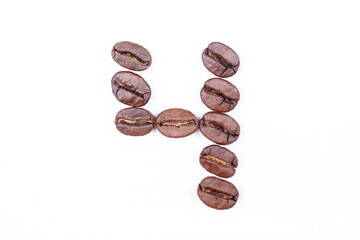 Number four made of coffee beans on a white background. Coffee beans isolated on white. Macro.