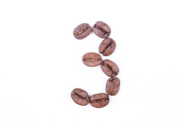 Naklejka premium Number three made of coffee beans on a white background. Coffee beans isolated on white. Macro.