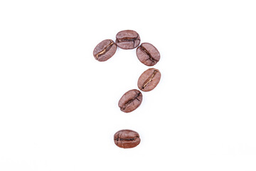 Question mark made of coffee beans on a white background. Coffee beans isolated on white. Macro.