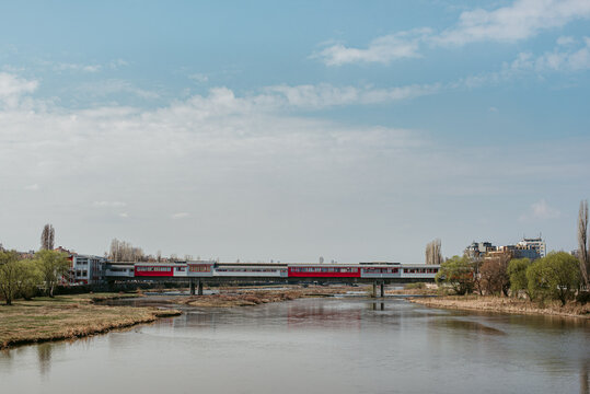 Colorful passage over river in town