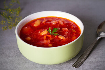 Beetroot soup made with vegetables beans and meat: borsht, bortsch, borshch, borscht