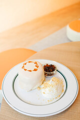 Bubble milk tea Soufflé pancake dessert. Japanese fluffy pancake topped with fresh cream and bubble/boba pearl with brown sugar syrup.