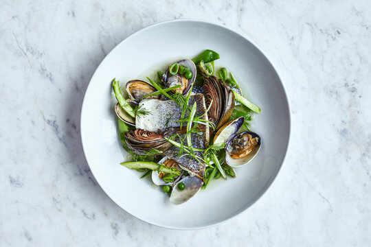 Sea bass and mussels served with fennels and green peas