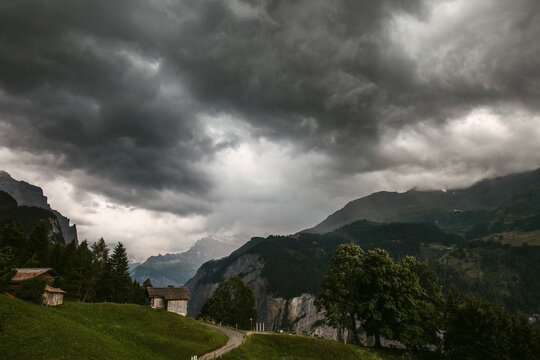 Mountain village under thunder sky in summer