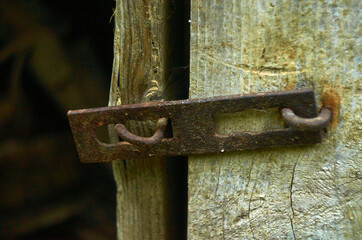 Photo of rusty latch without padlock