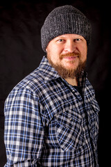 Fototapeta premium Solid bearded man in a wool cap portrait