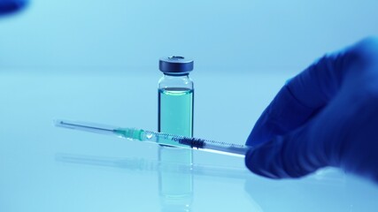 Doctor place vial with vaccine against virus near sterile needle syringe. Pre-clinical evaluation...