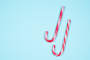 Candy canes on a light blue background