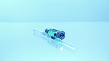 Vaccine vial with sterile needle syringe. Concept of medical research development and production of vaccine against coronavirus, COVID 19. Drugs and medications for pharmaceutical industry.