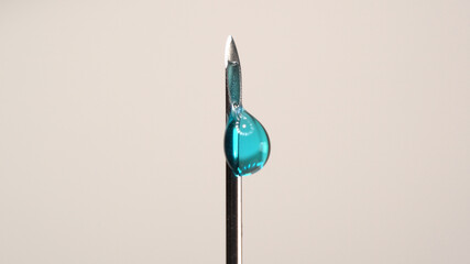 Medical vaccine dripping from the syringe needle. Concept of lab developing research of vaccine against Coronavirus, COVID-19. Pre-clinical evaluation and clinical phase trials development test