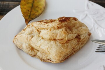 Delicious pastry croissant in a white plate 