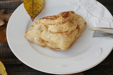 Delicious pastry croissant in a white plate 