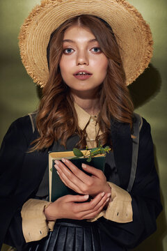Portrait of a young beautiful girl in Amish style clothes.