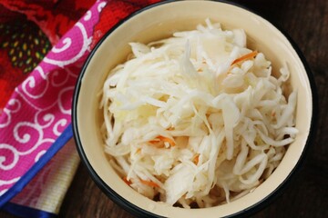 Sauerkraut with carrots on the table macro 
