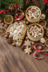 Hot cocoa with marshmallows and  cake portion on  wooden background. Christmas concept