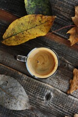 Espresso coffee and autumn leaves on the table 