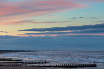 Beautiful seascape with pier at sunset time.