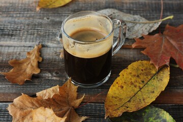 Espresso coffee and autumn leaves on the table 