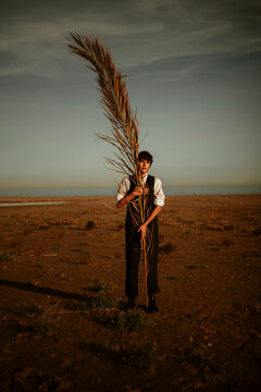 Androgynous woman at the sea.