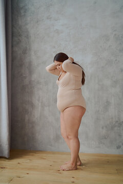 portrait of a beautiful young Asian woman in a swimsuit looking at the camera