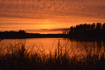bright orange sunset on the lake