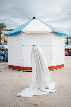 Ghost in front of a stand.