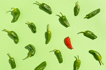 Green and red pepper pattern on green background.