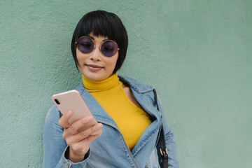 Asian Woman Holding Cellphone