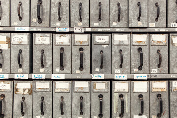 Rows of metal storage boxes in a shoe factory