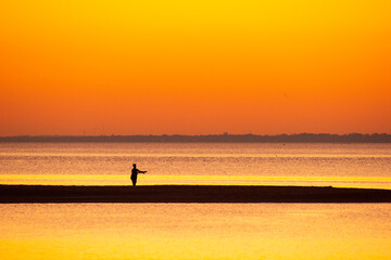 Fishing on the Beach at Sunset