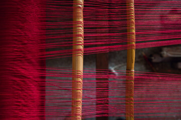 Red thread on wooden poles