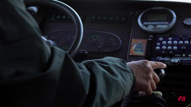 4K, Close-up of old male hands driver steering wheel in a bus, driving passenger. Transport in a communal road vehicle and carrying people, typically serving the public on a route and for a fare.-Dan