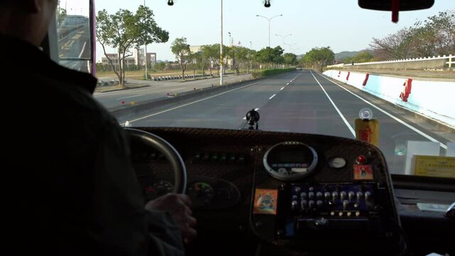 4K, Close-up of old male hands driver steering wheel in a bus, driving passenger. Transport in a communal road vehicle and carrying people, typically serving the public on a route and for a fare.-Dan