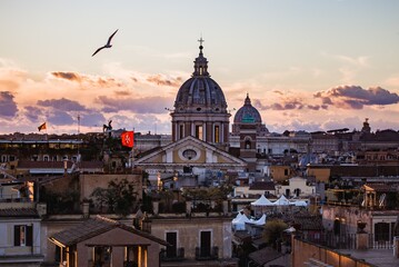 Fototapeta na wymiar Rome skyline at sunset with St. Peter's Basilica in center