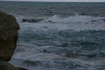 waves crashing on rocks