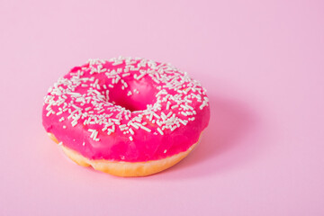 Colorful delicious donuts with sugar glaze on top