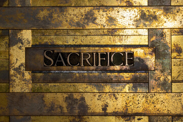 Sacrifice text on vintage textured grunge copper and gold background