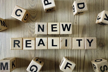 Text new reality from wooden blocks