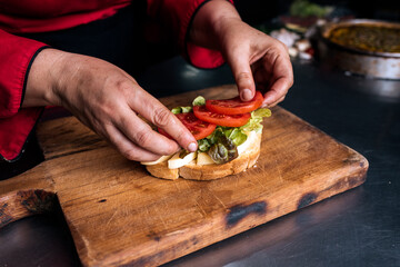 Unrecognizable chef doing Delicious Ham Toast