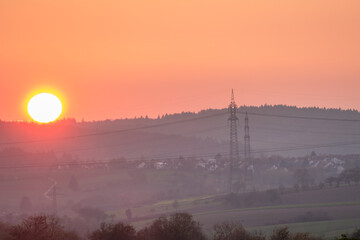 Naklejka premium Überlandleitung bei Sonnenuntergang
