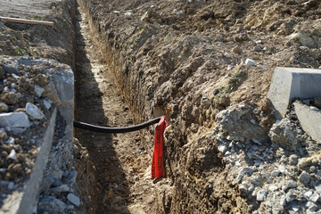 a long trench is prepared for laying communications