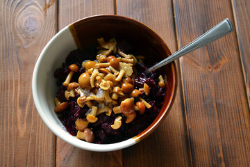 Mushrooms and beetroot salad in a ceramic bowl - shuhy, traditional western ukrainian dish