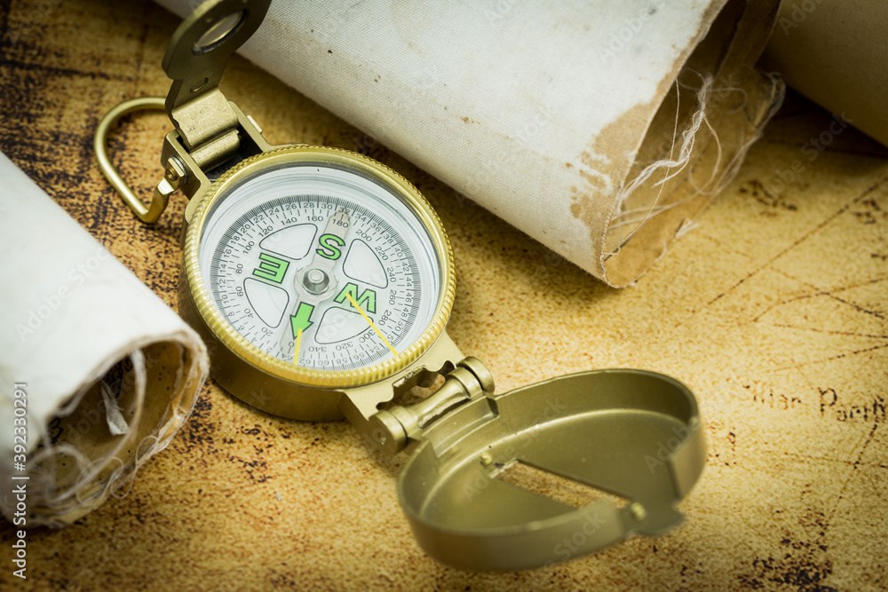 Poster old maps with a compass. the concept of expeditions and travel, discovering the world